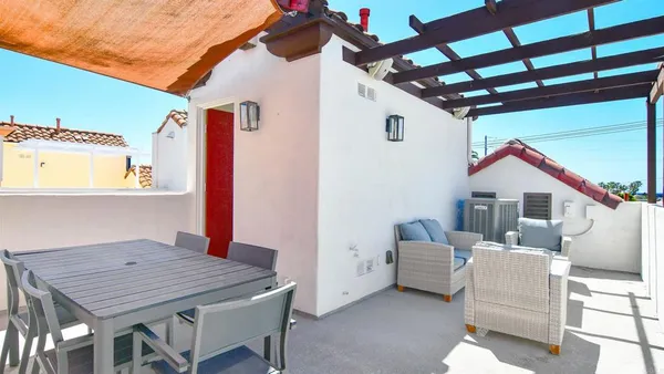 a outdoor space with patio the couches and a potted plant on a table