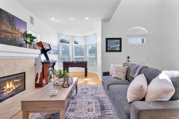 a living room with furniture and a fireplace