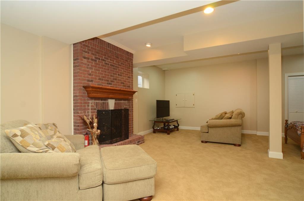 2132 John's Ridge Road Coraopolis, PA 15108 - Photo 20 of 25 The lower level has a fireplace & provides a wonderful entertaining space.