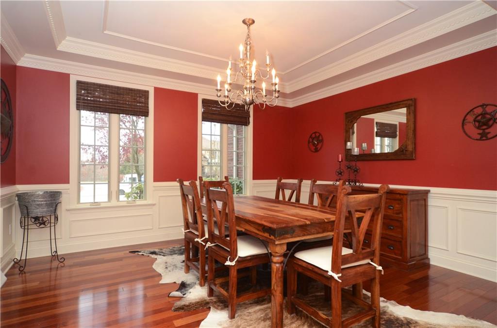 2132 John's Ridge Road Coraopolis, PA 15108 - Photo 3 of 25 Elegant dining room with tray ceiling, wainscoting, crown molding and gleaming wood floors.