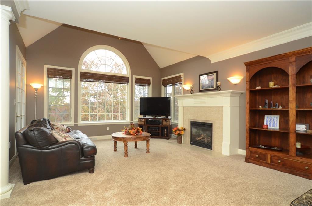 2132 John's Ridge Road Coraopolis, PA 15108 - Photo 7 of 25 Family room with wall of windows that bring in the tree top views. Lovely fireplace for cozy winter nights.