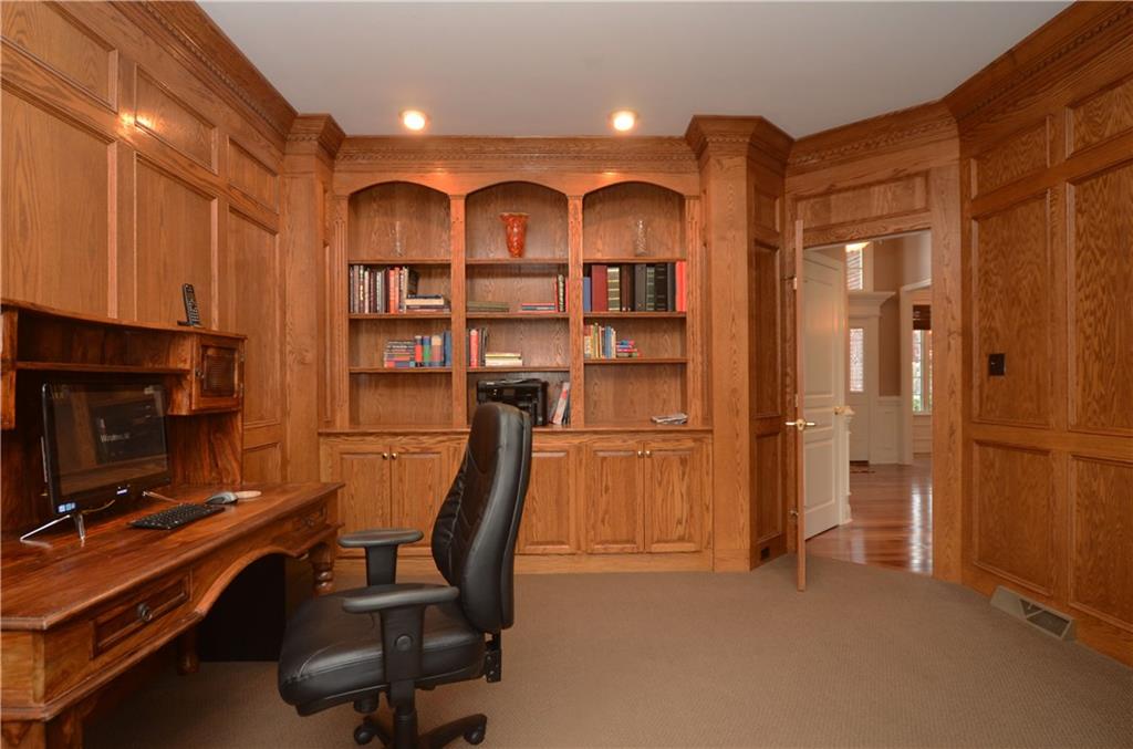 2132 John's Ridge Road Coraopolis, PA 15108 - Photo 10 of 25 The paneled den has handy built-in bookshelves and storage cabinets.