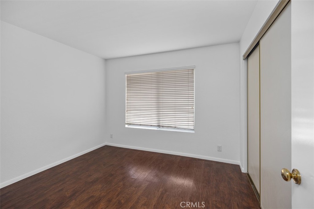 57 Rabano Rancho Santa Margarita, CA 92688 - Photo 11 of 29 an empty room with wooden floor and windows