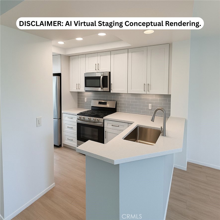 57 Rabano Rancho Santa Margarita, CA 92688 - Photo 8 of 29 a kitchen with white cabinets and stainless steel appliances