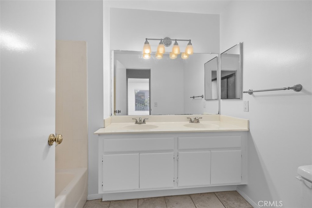 57 Rabano Rancho Santa Margarita, CA 92688 - Photo 10 of 29 a bathroom with a sink and a mirror
