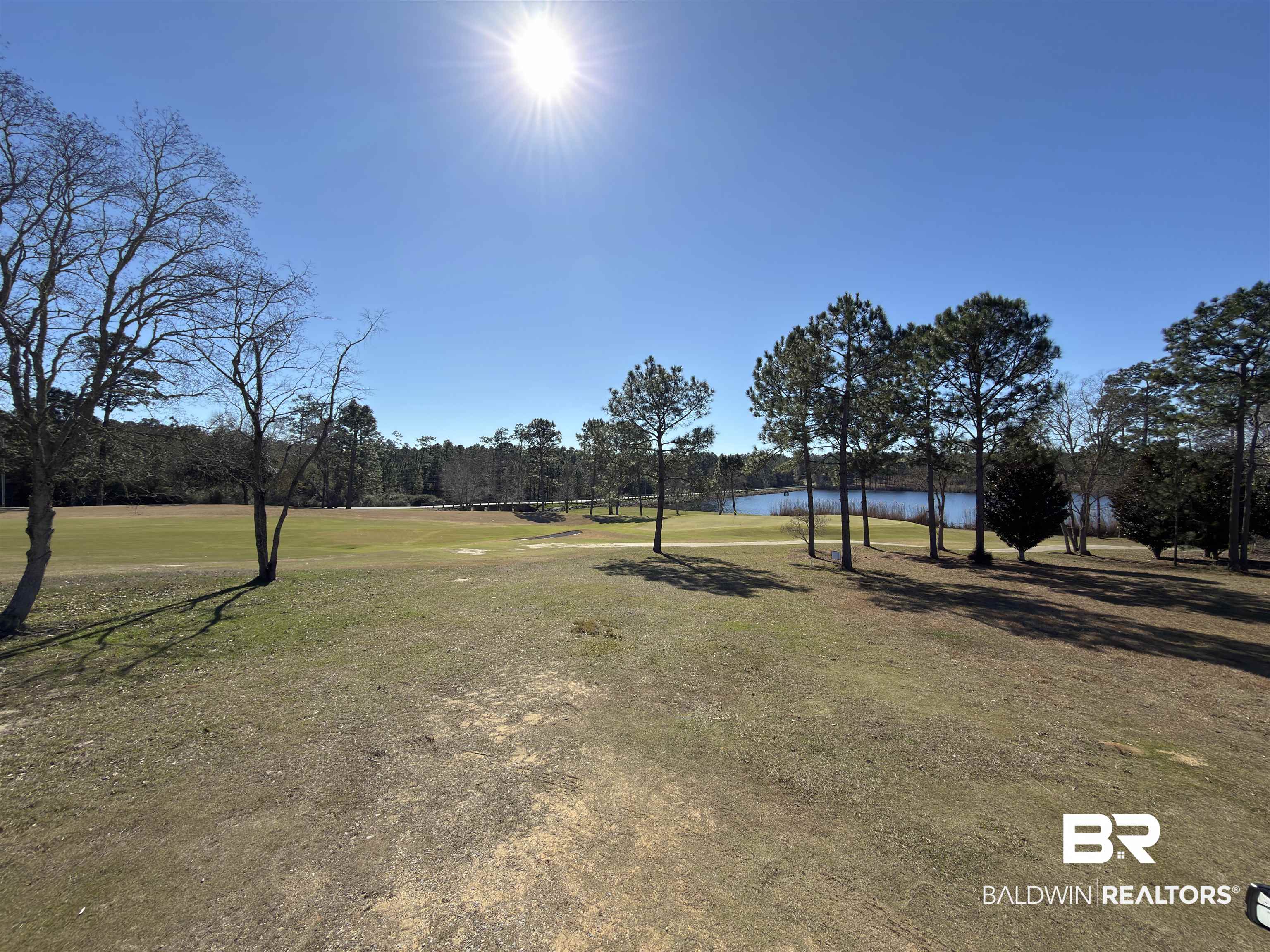 East Water View Drive East Loxley, AL 36551 - Photo 1 of 11 View of property's community with a water view, view of wooded area, golf course view, and a yard