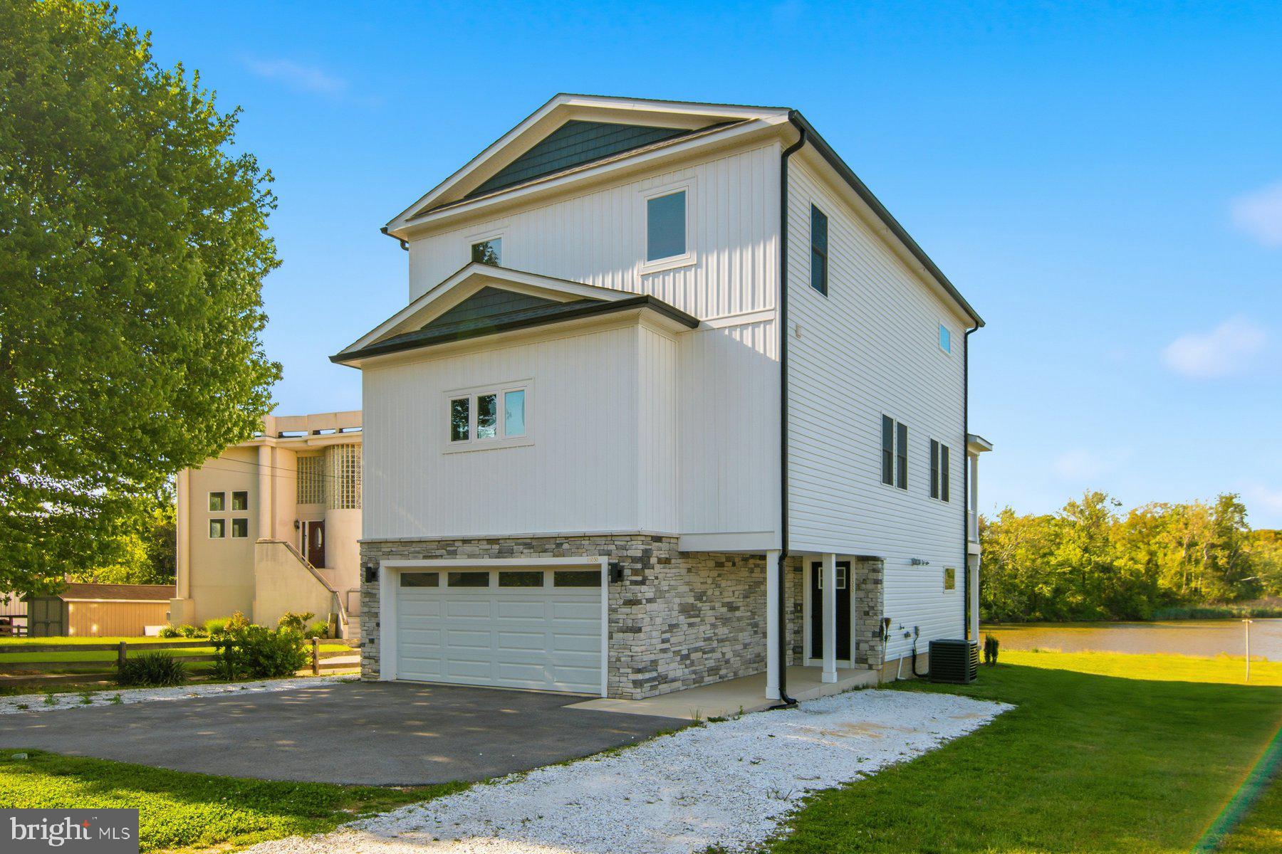 11030 Bird River Grove Road White Marsh, MD 21162 - Photo 51 of 53 a front view of a house with garden