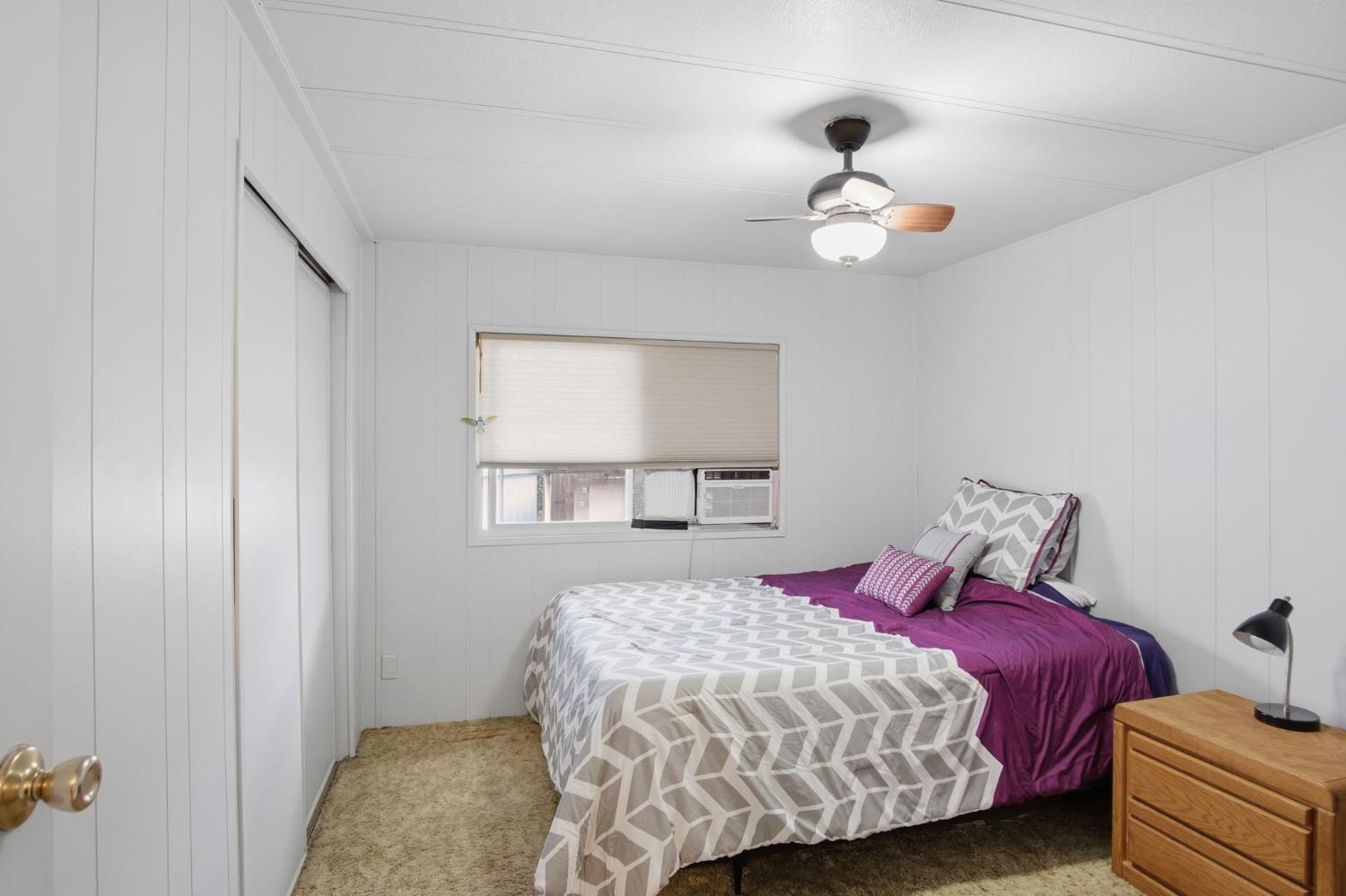 1400 Meredith Avenue, Unit 55 Gustine, CA 95322 - Photo 14 of 19 a bedroom with a bed and a window