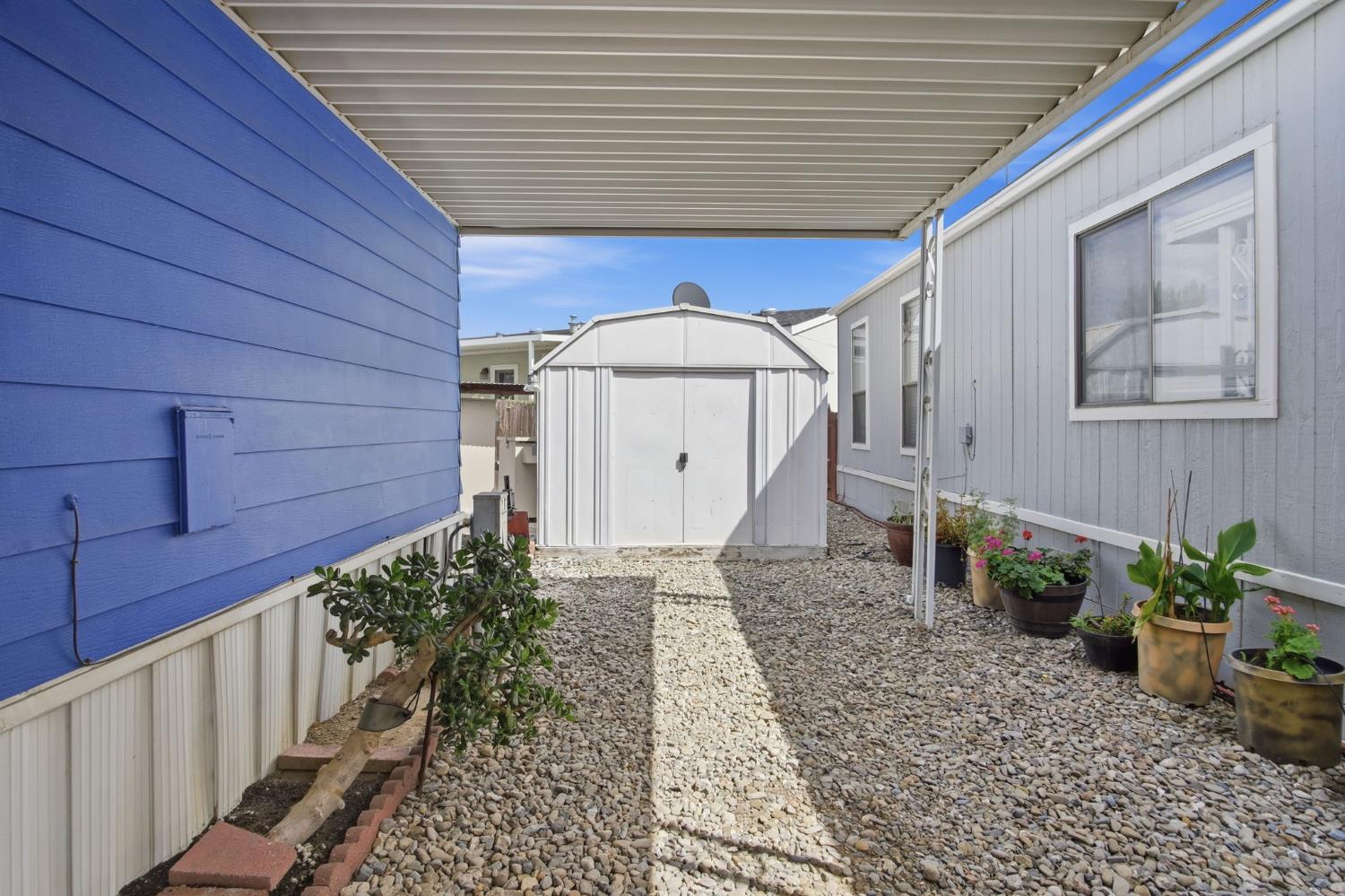 1400 Meredith Avenue, Unit 55 Gustine, CA 95322 - Photo 18 of 19 a view of a house with a yard