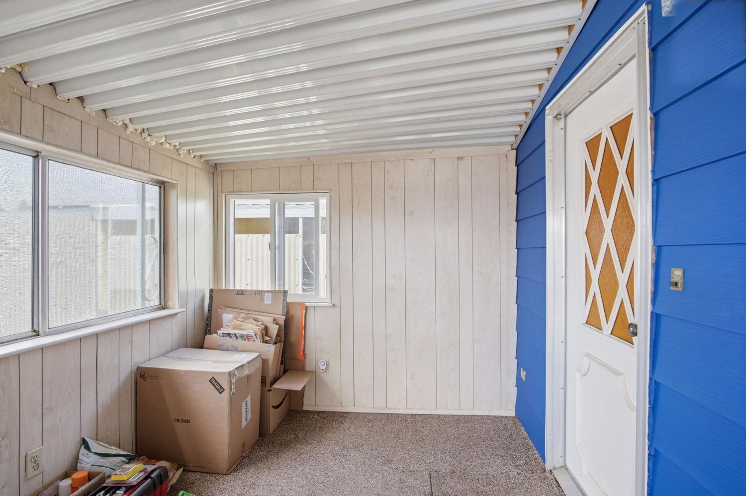 1400 Meredith Avenue, Unit 55 Gustine, CA 95322 - Photo 5 of 19 a living room with a couch and windows