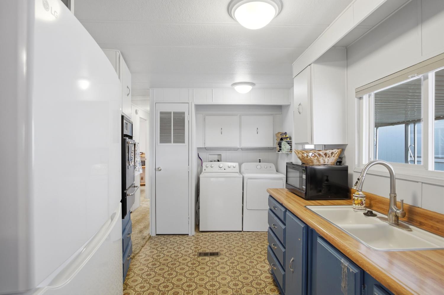 1400 Meredith Avenue, Unit 55 Gustine, CA 95322 - Photo 8 of 19 a kitchen with a sink appliances cabinets and a counter top space