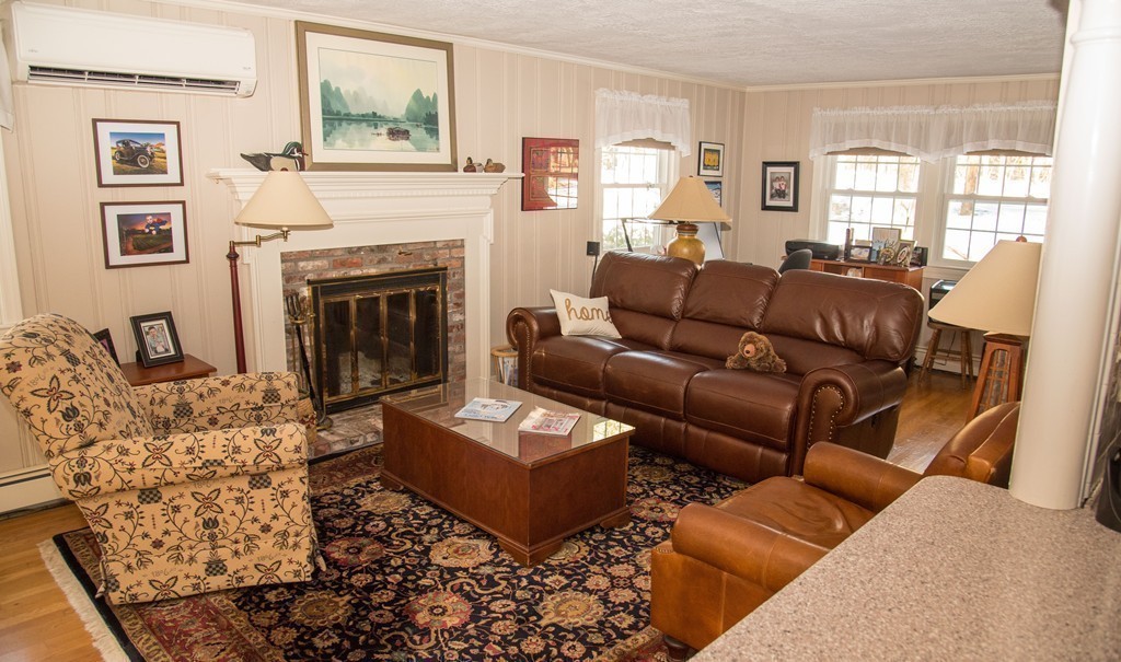 83 Concord Road Acton, MA 01720 - Photo 13 of 30 a living room with furniture fireplace and window
