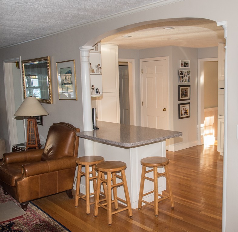 83 Concord Road Acton, MA 01720 - Photo 15 of 30 a living room with furniture and a wooden floor