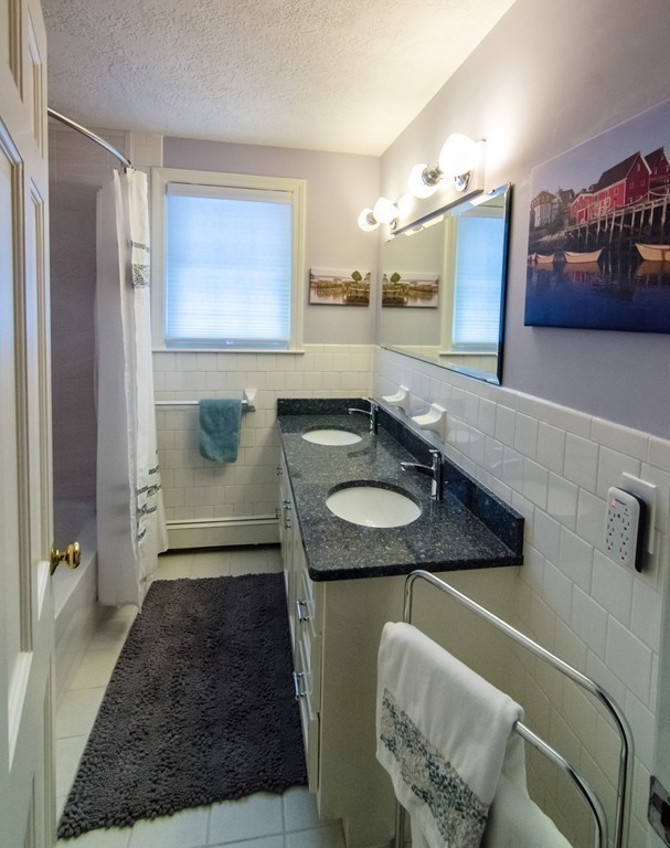 83 Concord Road Acton, MA 01720 - Photo 20 of 30 a bathroom with a granite countertop sink and a mirror