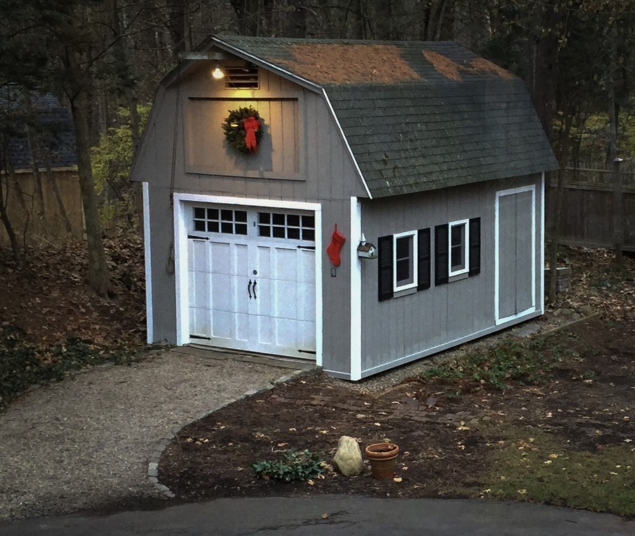 83 Concord Road Acton, MA 01720 - Photo 25 of 30 a front view of a house with a yard