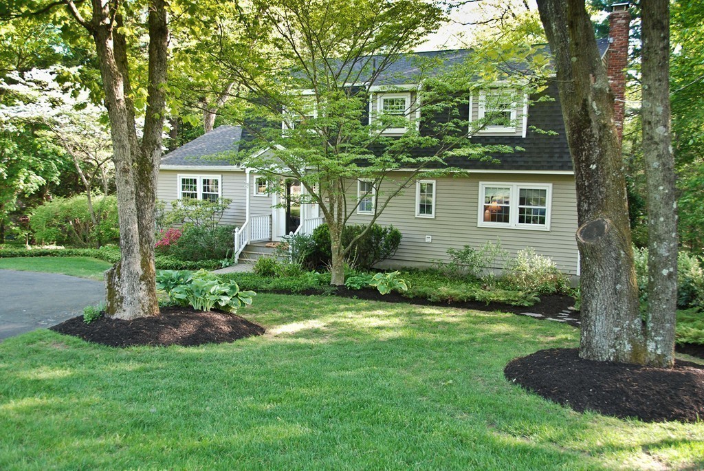 83 Concord Road Acton, MA 01720 - Photo 26 of 30 a front view of a house with a yard and trees