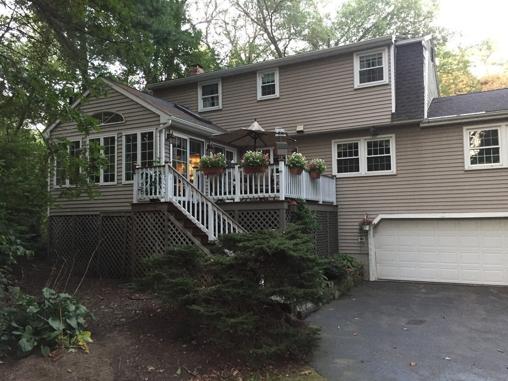83 Concord Road Acton, MA 01720 - Photo 27 of 30 a front view of house with yard and green space