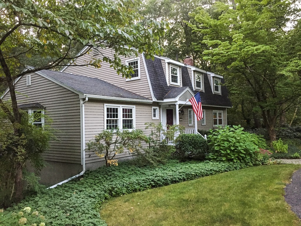 83 Concord Road Acton, MA 01720 - Photo 30 of 30 a front view of a house with a yard and potted plants