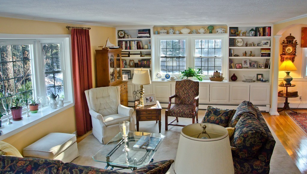 83 Concord Road Acton, MA 01720 - Photo 5 of 30 a living room with furniture and a bookshelf