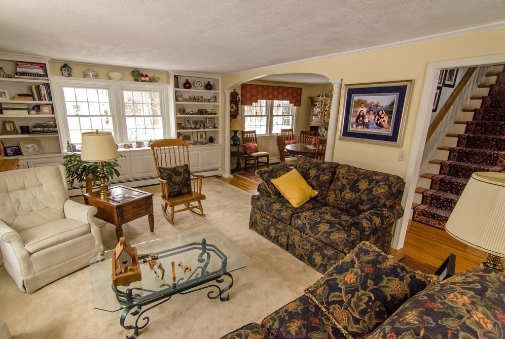 83 Concord Road Acton, MA 01720 - Photo 6 of 30 a living room with furniture windows and a flat screen tv