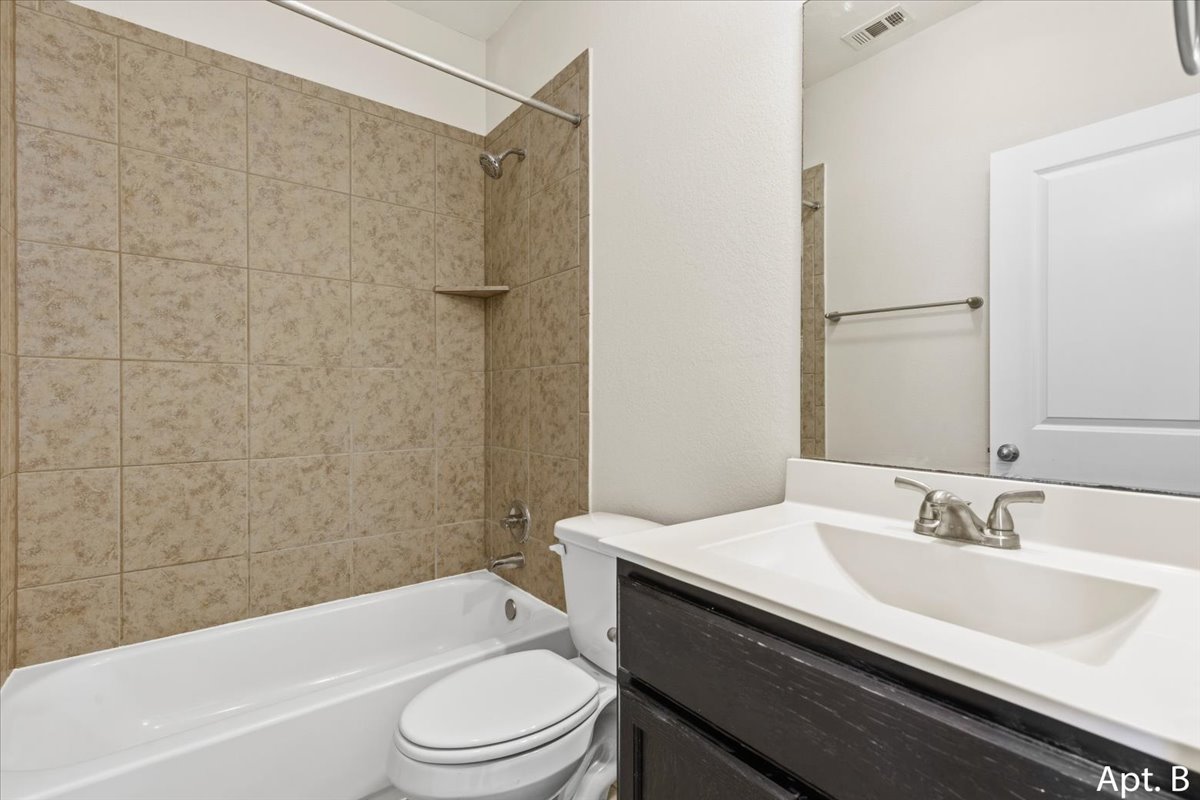 2225 Katy Lane, Unit B Georgetown, TX 78626 - Photo 19 of 22 a bathroom with a sink a toilet and shower