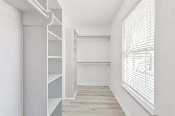 a view of an empty walk in closet