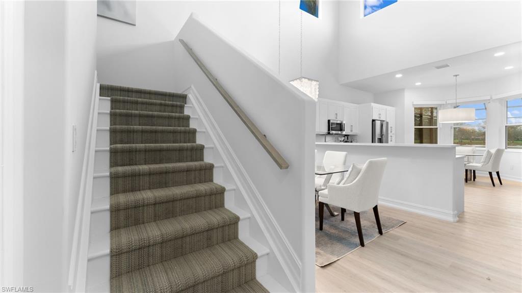 6172 Dogleg Drive Naples, FL 34113 - Photo 27 of 45 a view of entryway and dining room with furniture