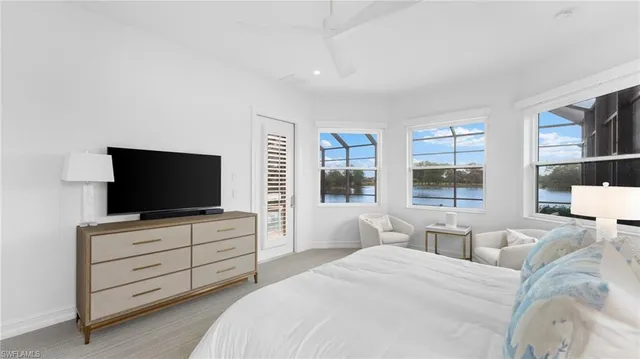 a bed room with two bed and a large window