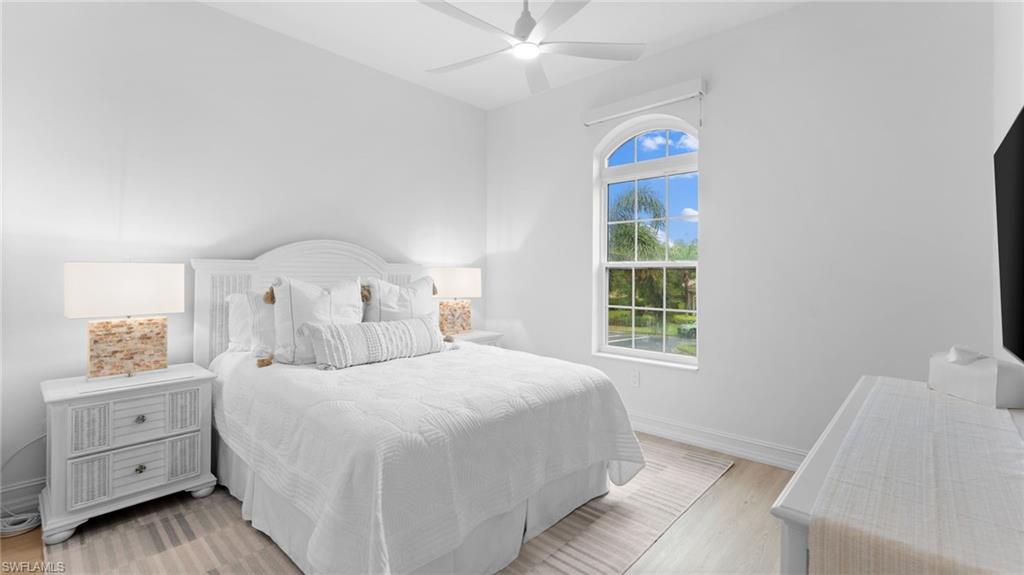 6172 Dogleg Drive Naples, FL 34113 - Photo 40 of 45 a bedroom with a bed and a window