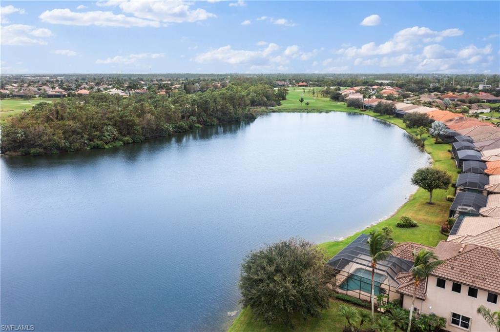 6172 Dogleg Drive Naples, FL 34113 - Photo 42 of 45 an aerial view of a house with a lake view
