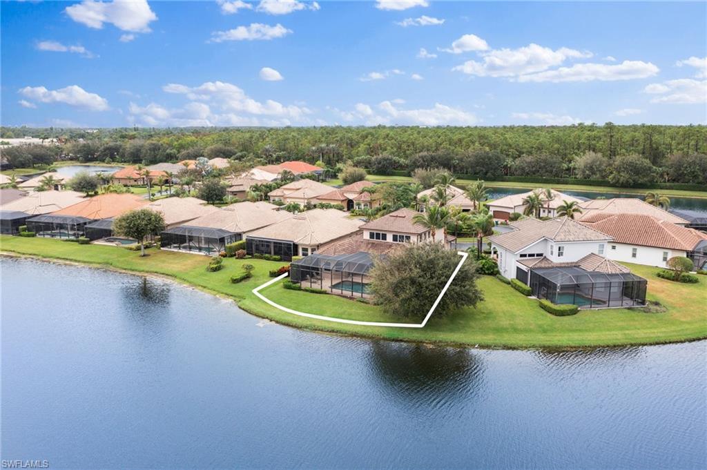 6172 Dogleg Drive Naples, FL 34113 - Photo 45 of 45 a view of a lake in middle of the town