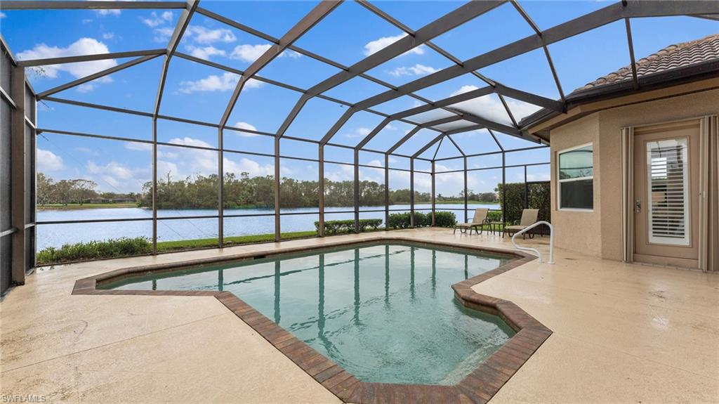 6172 Dogleg Drive Naples, FL 34113 - Photo 10 of 45 a view of a swimming pool with a porch
