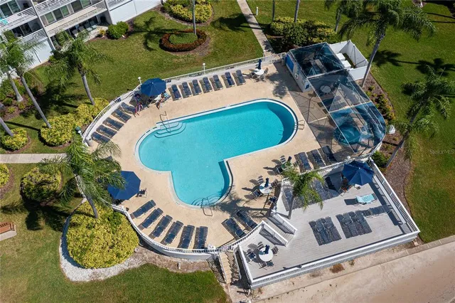 an aerial view of a swimming pool and outdoor space