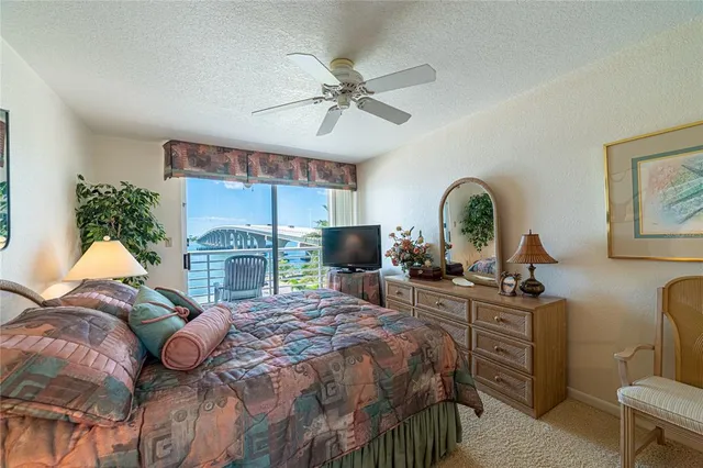 a bed room with a bed and a mirror