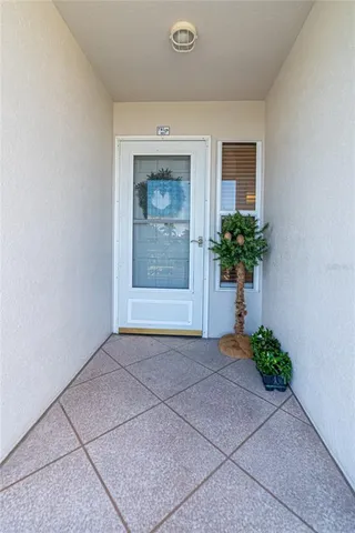 a view of an entryway with a flower pot