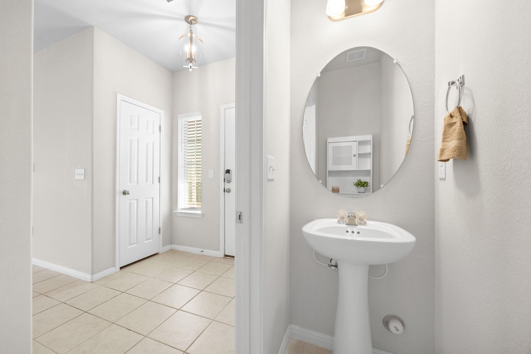 1612 Catalan Road, Unit 201 Austin, TX 78748 - Photo 21 of 35 a bathroom with a sink a mirror and shower