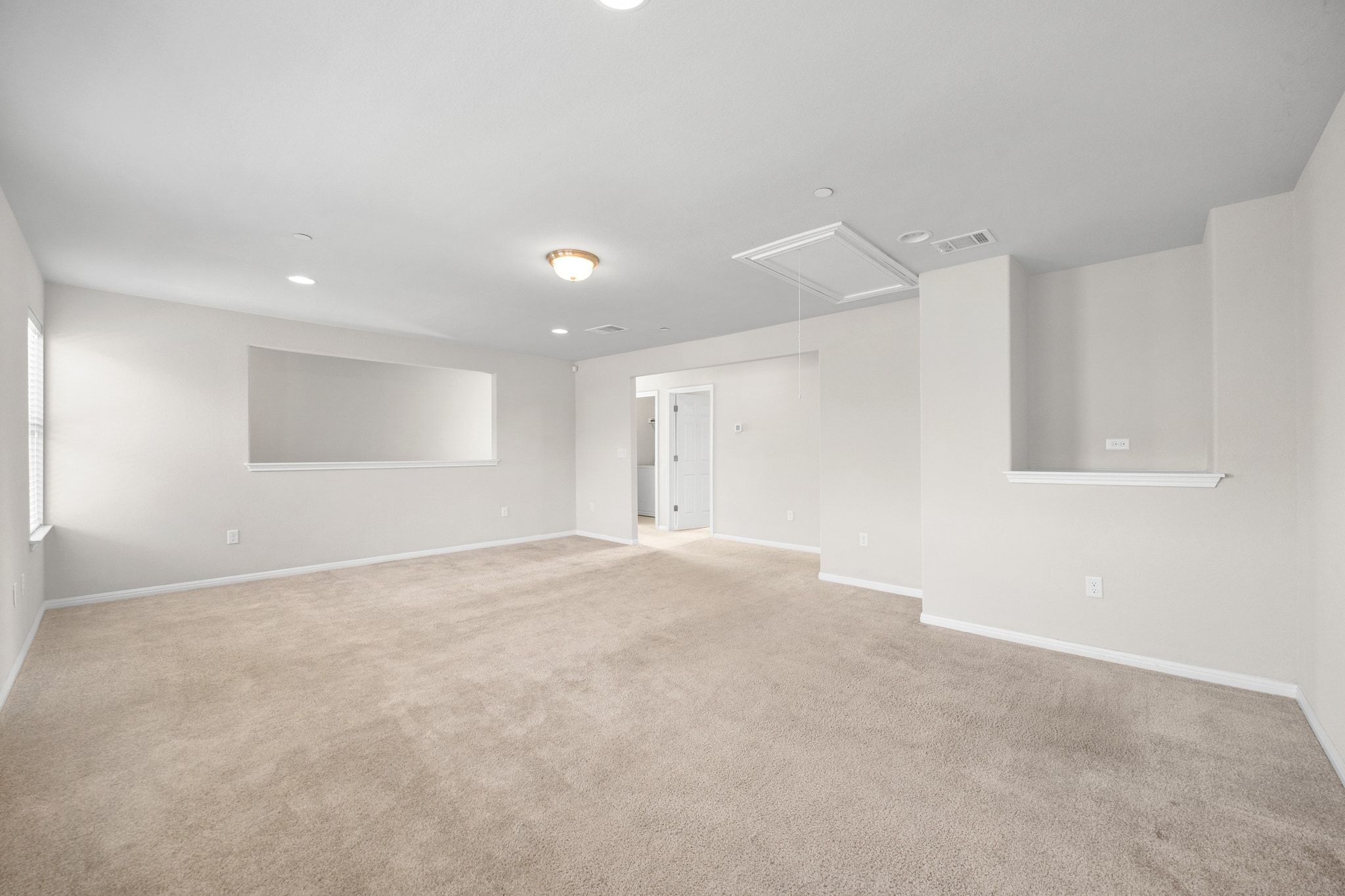 1612 Catalan Road, Unit 201 Austin, TX 78748 - Photo 23 of 35 a view of an empty room with wooden floor and a window