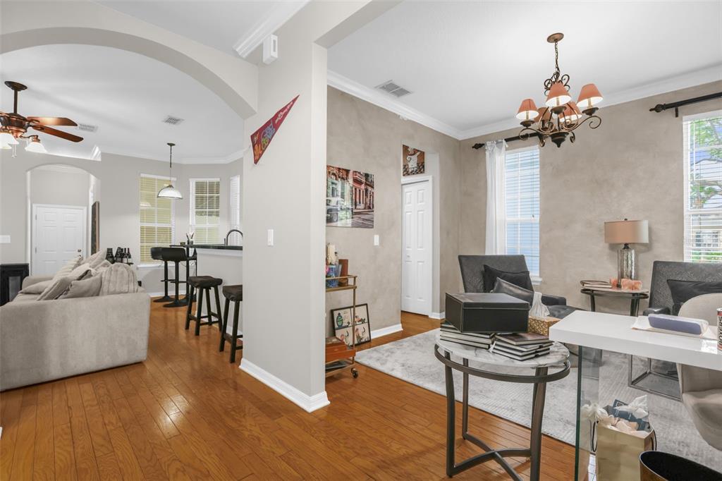 2165 Ridgewood Street Orlando, FL 32803 - Photo 6 of 37 a living room with furniture and a chandelier