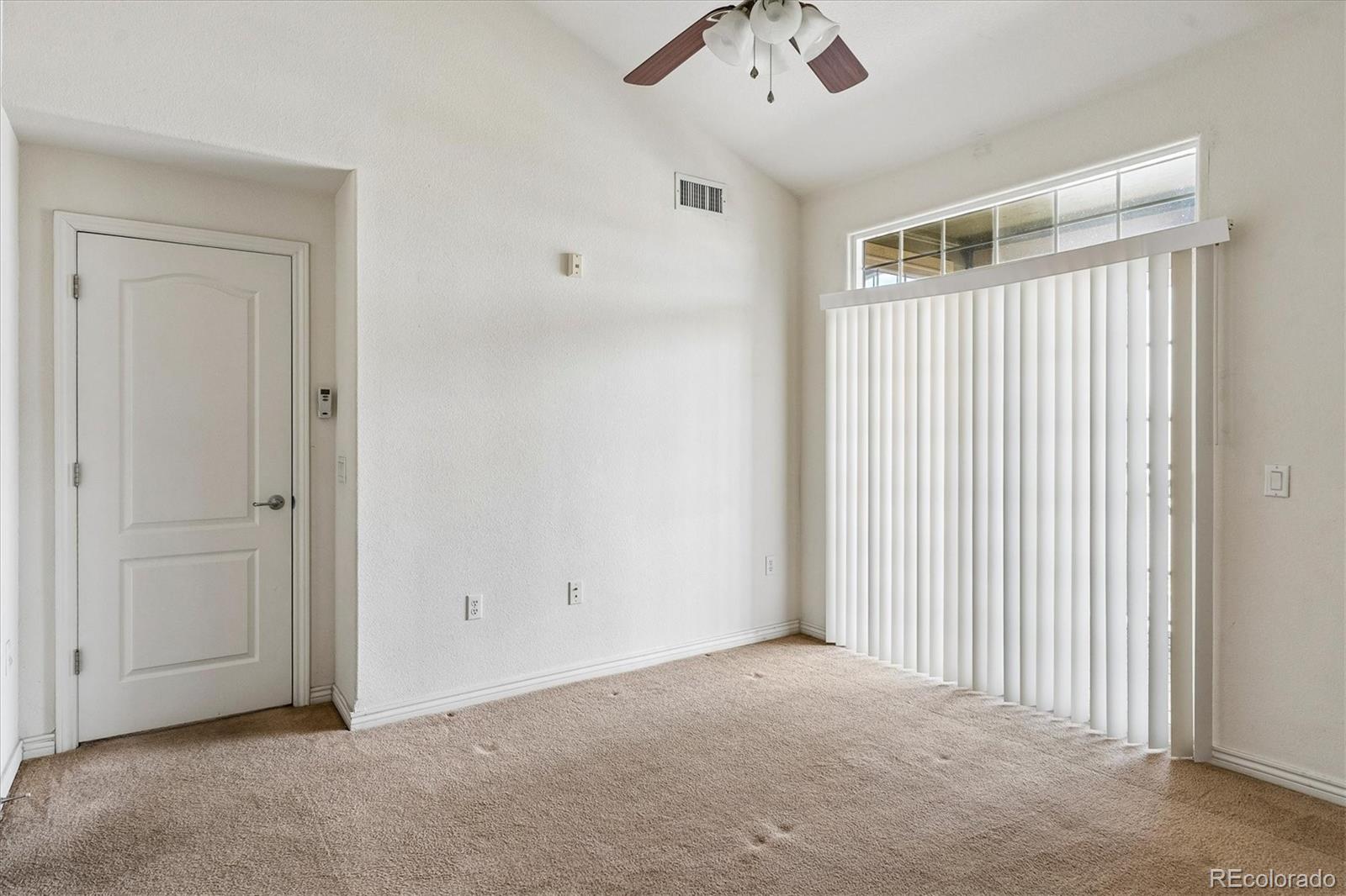 18657 Stroh Road, Unit 4207 Parker, CO 80134 - Photo 14 of 39 an empty room with a empty space and windows