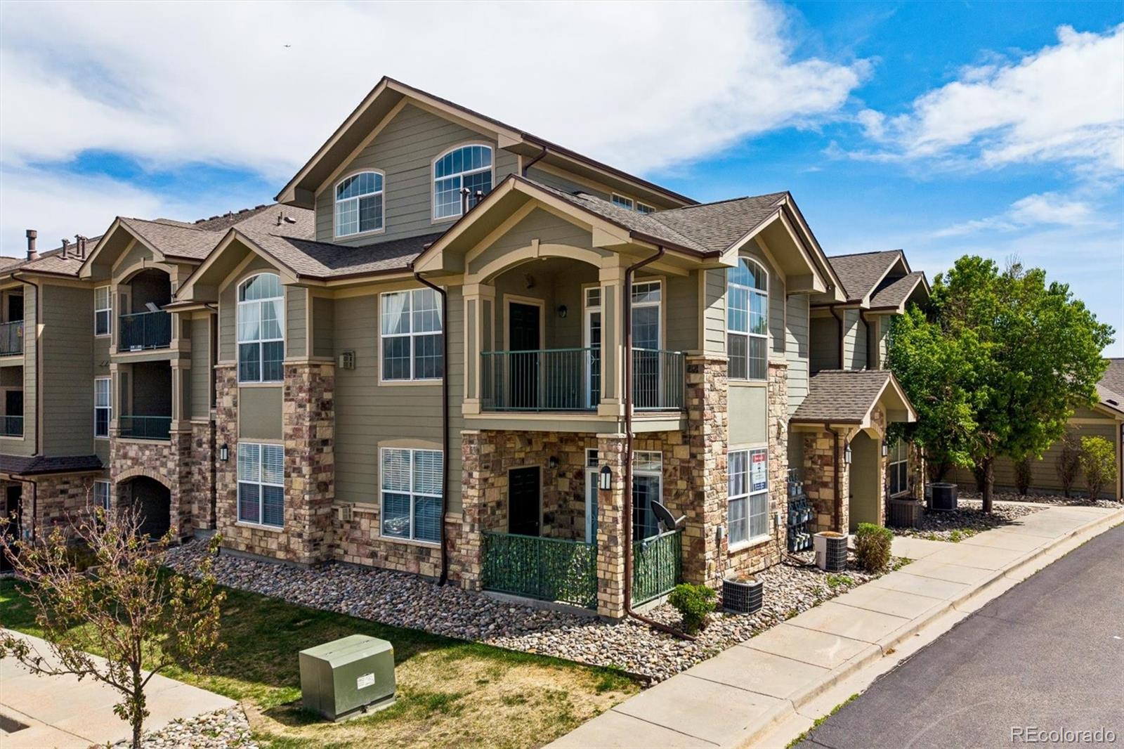 18657 Stroh Road, Unit 4207 Parker, CO 80134 - Photo 2 of 39 a front view of a house with garden