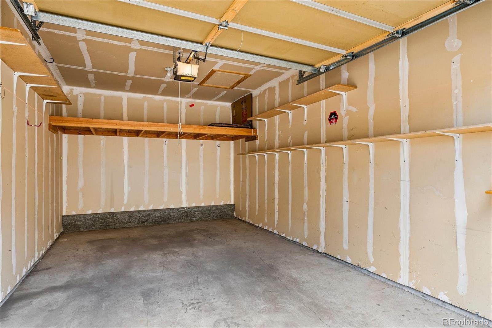 18657 Stroh Road, Unit 4207 Parker, CO 80134 - Photo 27 of 39 a view of a garage with wooden walls