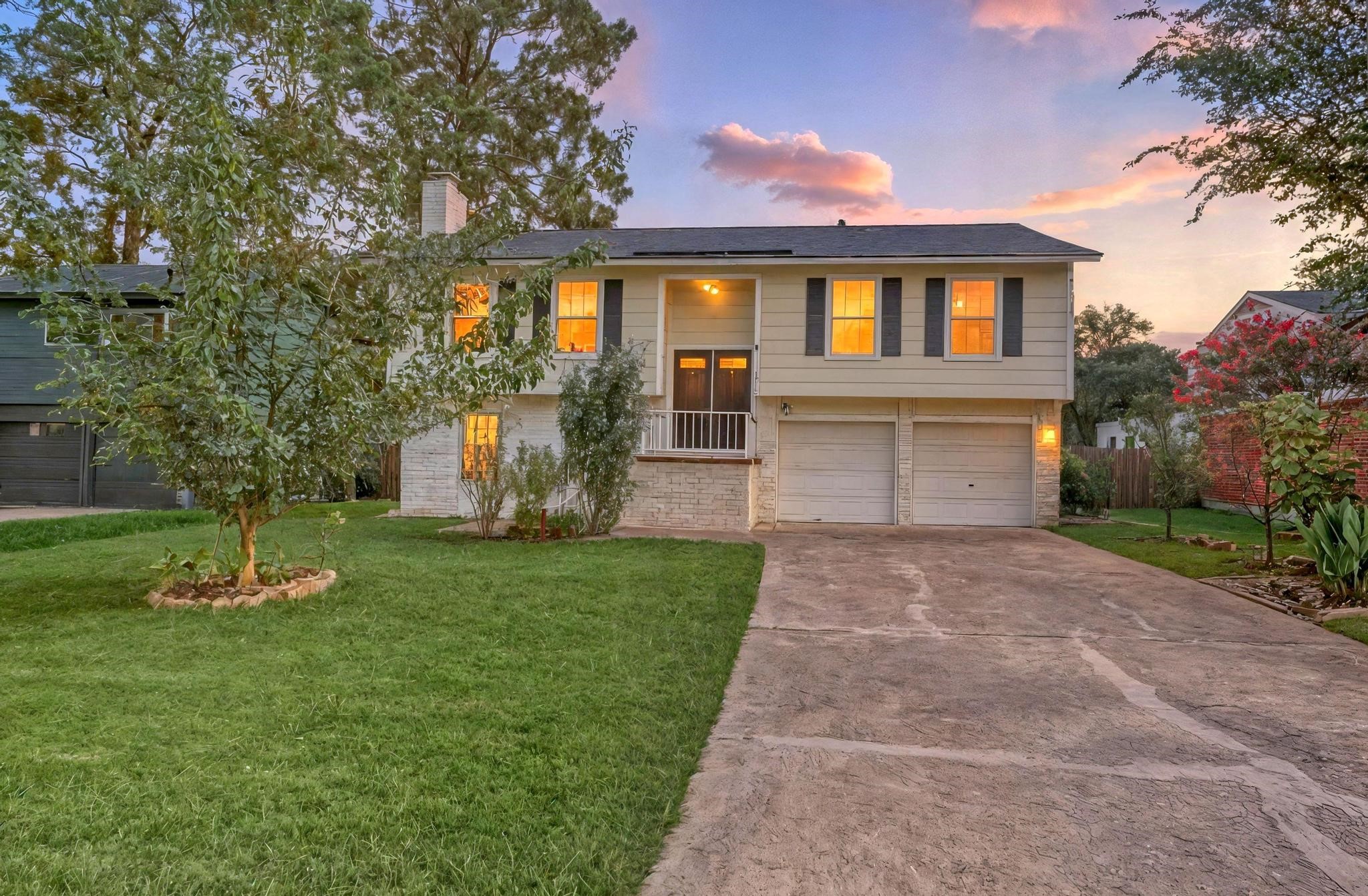 14418 Louetta Road Cypress, TX 77429 - Photo 1 of 39 a front view of a house with a yard and a garage