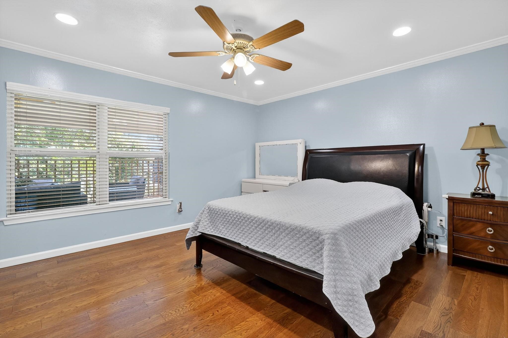 14418 Louetta Road Cypress, TX 77429 - Photo 11 of 39 a bedroom with a bed and window