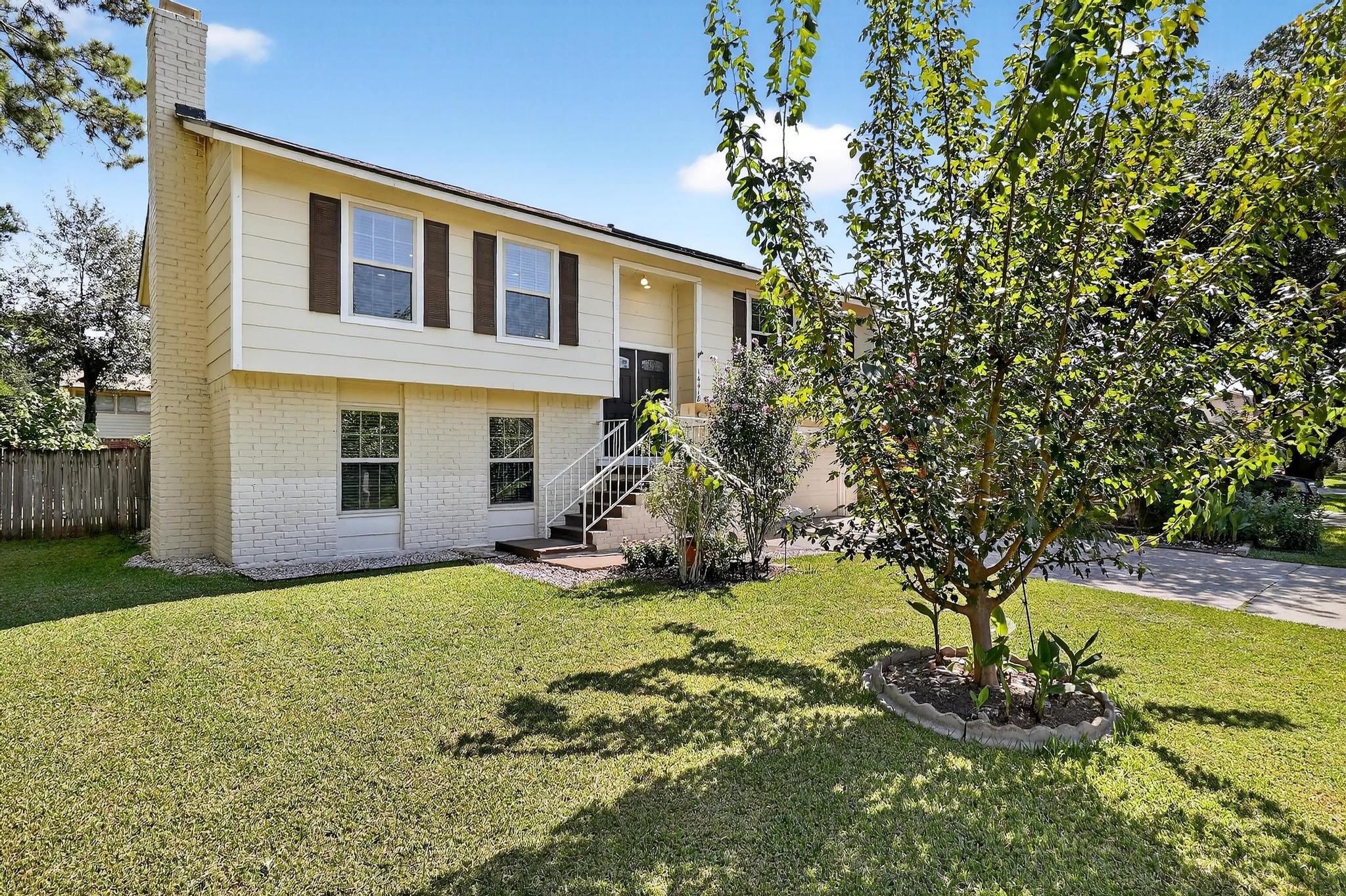 14418 Louetta Road Cypress, TX 77429 - Photo 13 of 39 a view of a house with backyard and sitting area