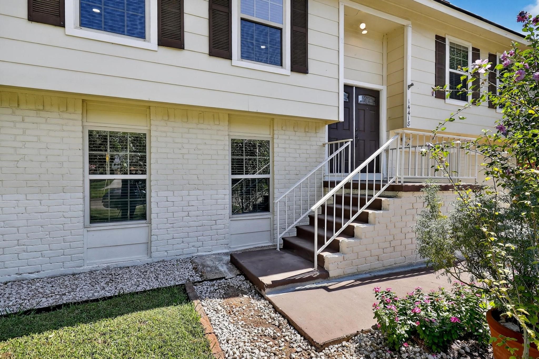 14418 Louetta Road Cypress, TX 77429 - Photo 14 of 39 a front view of a house with a yard
