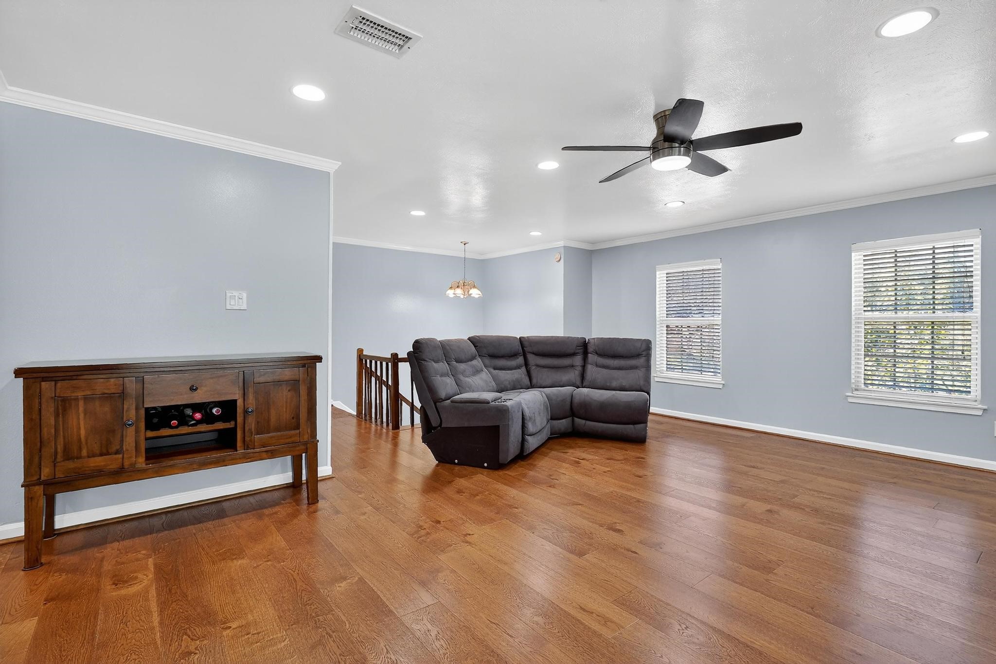 14418 Louetta Road Cypress, TX 77429 - Photo 16 of 39 a living room with furniture and a fireplace