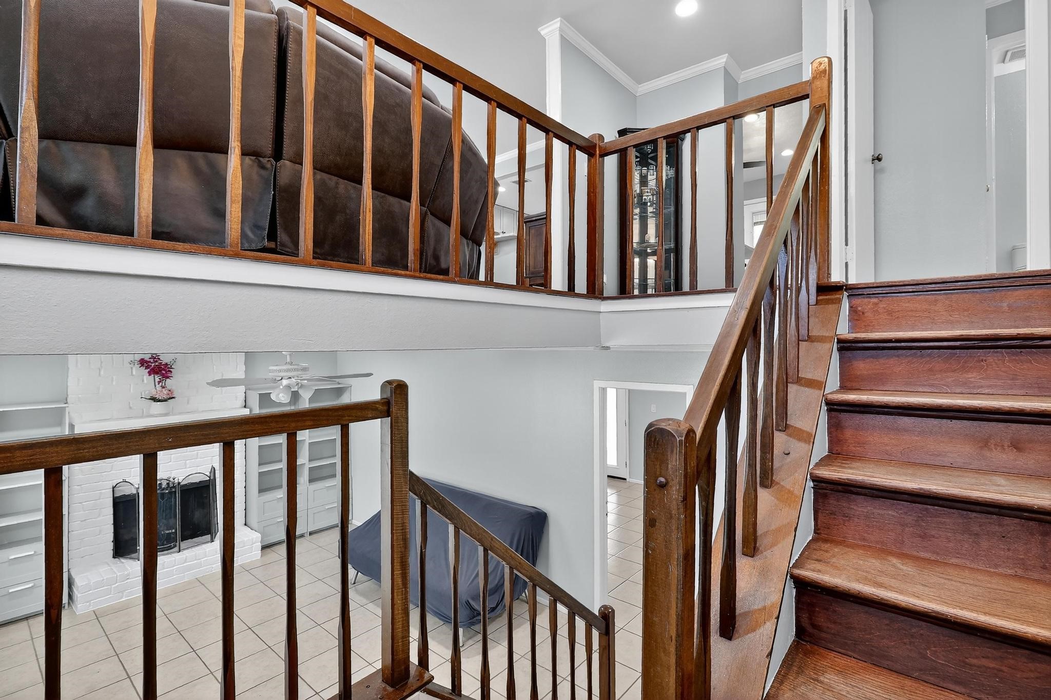 14418 Louetta Road Cypress, TX 77429 - Photo 21 of 39 a view of staircase with railing and lots of windows