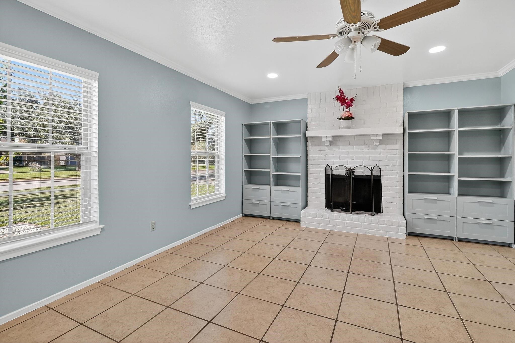 14418 Louetta Road Cypress, TX 77429 - Photo 23 of 39 a view of an empty room with a window and fireplace