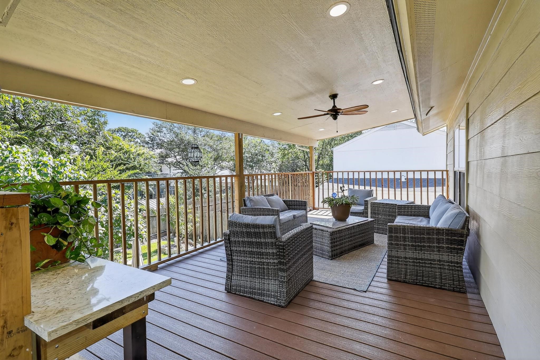 14418 Louetta Road Cypress, TX 77429 - Photo 29 of 39 a living room with furniture a wooden floor and a large window