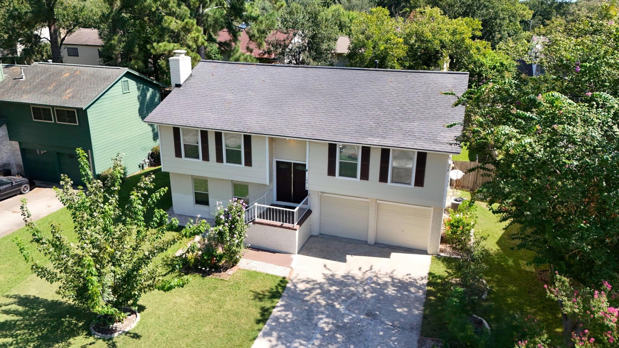14418 Louetta Road Cypress, TX 77429 - Photo 34 of 39 an aerial view of a house with a yard and potted plants